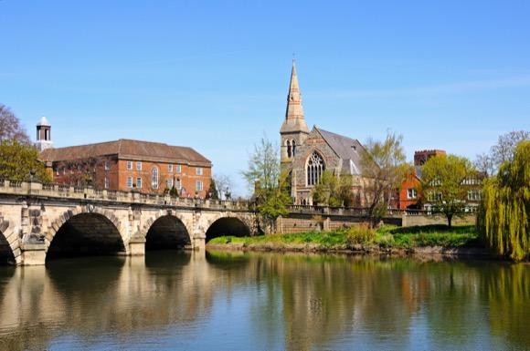 shropshire village looking over lake and bridge with church in the background